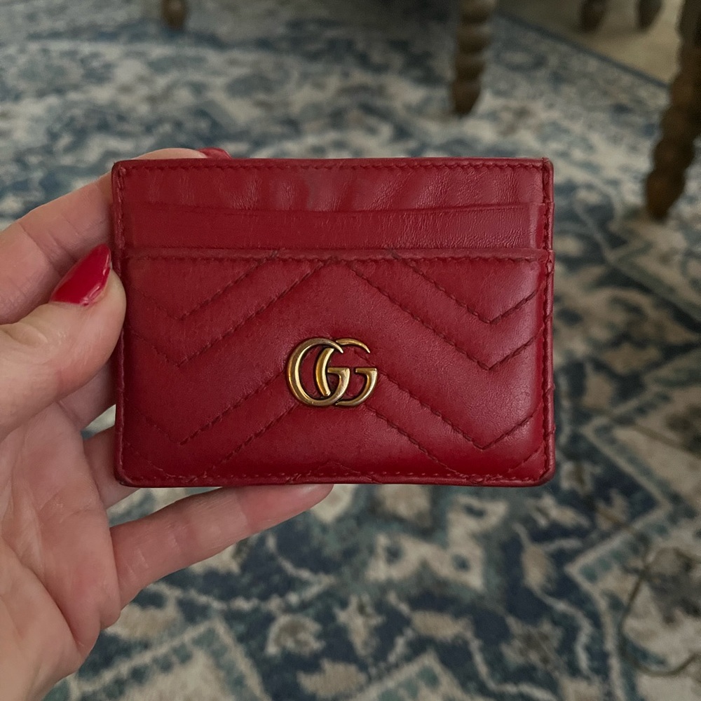 Red Gucci credit card holder.